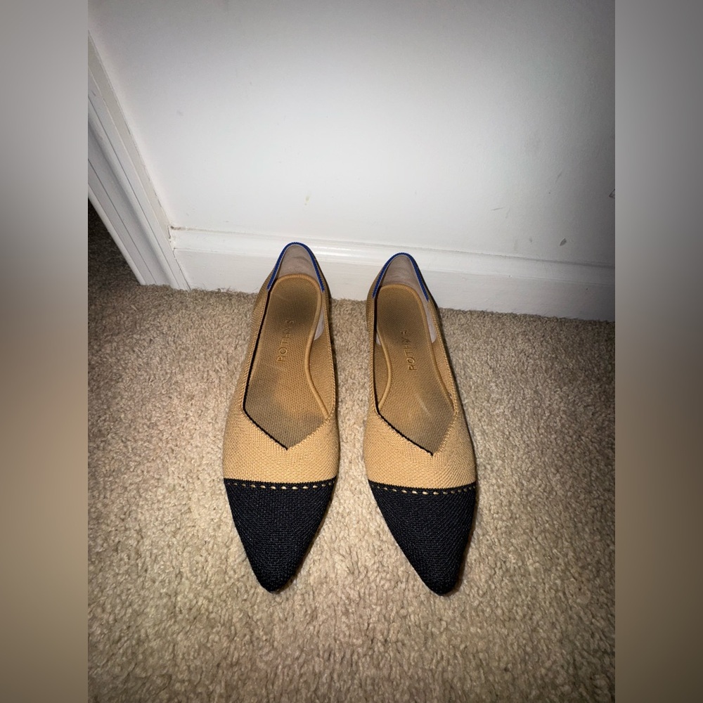 Rothy pointed toe flats in colors black and tan